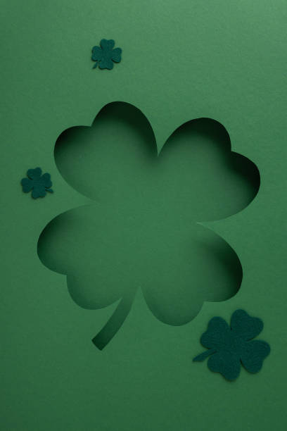 A vertical charming clover-themed green cutout design symbolizing St. Patrick's Day celebration and luck