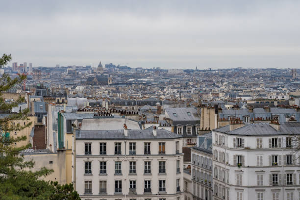 istock View of Paris rooftops under a cloudy sky in late afternoon light 2196776199