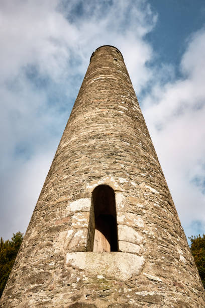 istock Ancient round tower in Glendalough, Wicklow Mountains, Ireland, with medieval stonework 2196778763