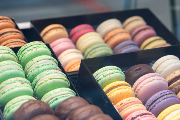 Colorful French macarons displayed in a delightful bakery showcase