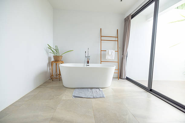 istock Modern Bathroom with Freestanding Bathtub and Bubbles 2196781080