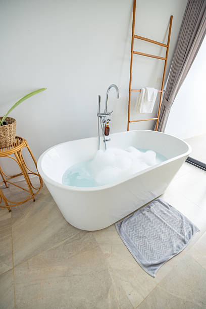 istock Modern Bathroom with Freestanding Bathtub and Bubbles 2196781176