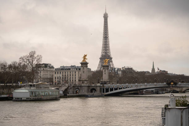A view of the Seine river in Paris with the Eiffel Tower in the background