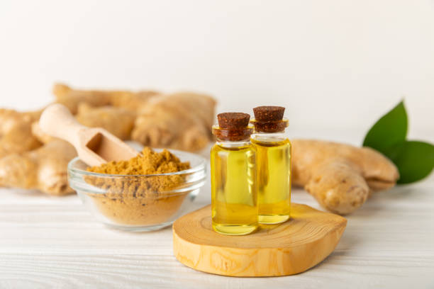 istock Ginger essential oil on texture background. Fresh ginger slices. Essence, serum, oil. Alternative medicine. Phytotherapy. Health and beauty concept. Place for text. Copy space. 2196782386
