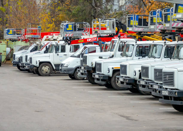Russia, Voronezh -  November 01, 2023: A row of specialized power grid aerial platforms in a parking lot