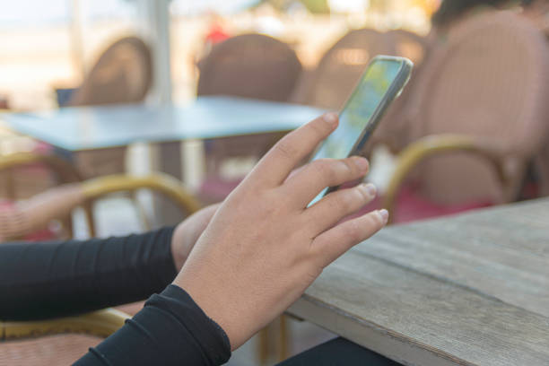 istock Young person interacting with mobile phone 2196782646