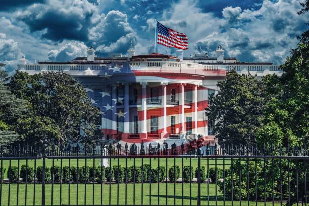 istock The White House with waving American flag 2196782854