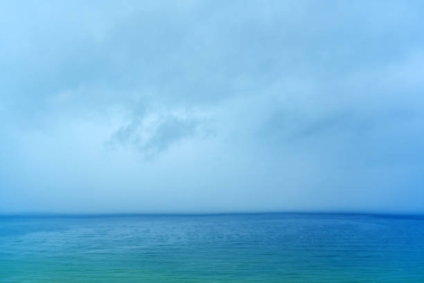 Downpour rain sea wall falling into the sea.