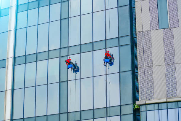 istock Work on the heights. Industrial mountaineering, group of workers cleaning windows service on high rise building. 2196785882