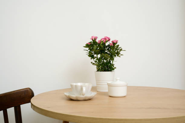 istock Cozy and Inviting Dining Table Set with Beautiful Floral Arrangement and Elegant Tea Set 2196786160