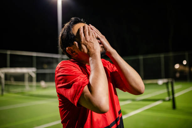 istock Men engage in nighttime soccer match on a field in Sydney, showcasing teamwork and active lifestyles 2196786441