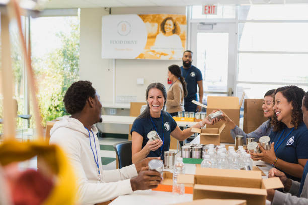 istock Volunteers Sorting Food Donations at a Food Drive 2196786690