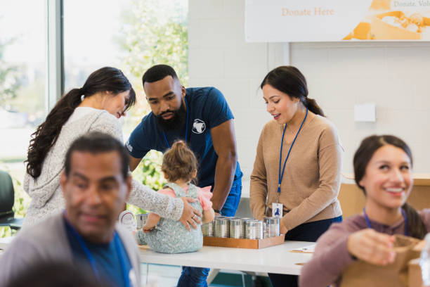 istock Volunteers Sorting Food Donations at a Charity Event 2196786704
