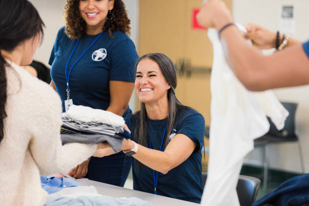 Volunteers Sorting Clothing Donations at Charity