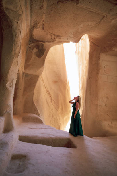 istock Woman Exploring an Ancient Cave Dwelling in Cappadocia, Turkey 2196792364