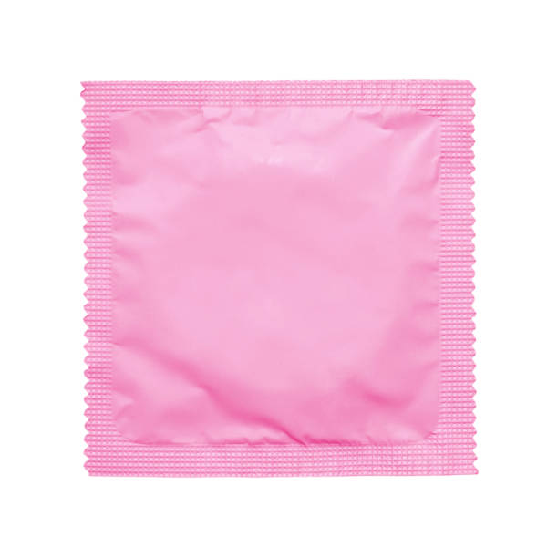 istock A vibrant matte pink sealed foil condom wrapper isolated on a clean white background, ideal for health, safe sex, and lifestyle-related stock photography. 2196792475