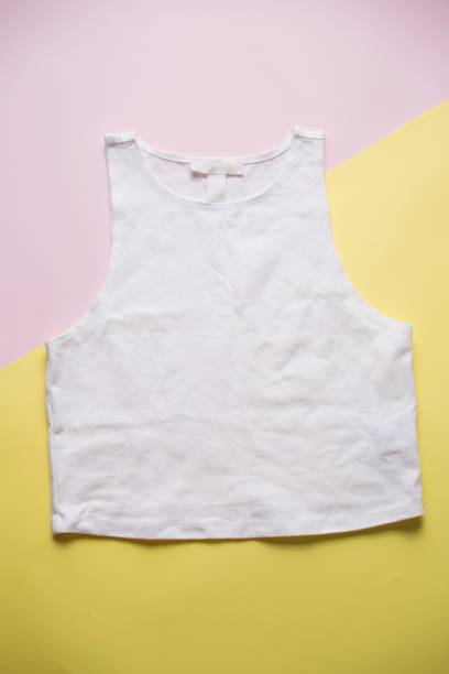 istock White cropped tank top on pink and yellow background 2196792560