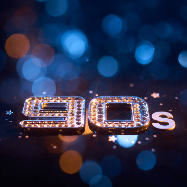 istock Shimmering Retro 90s Text with Glittering Accents and Blue Bokeh Lights in Nostalgic Still Life 2196792646