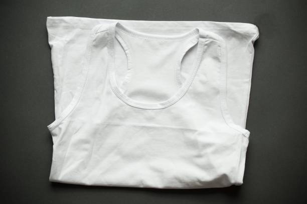 istock White folded sleeveless shirt on dark background 2196792723