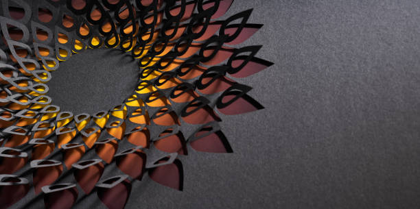 istock Intricate teardrop mandala cut paper artwork with gradient orange and yellow tones on dark background 2196792727