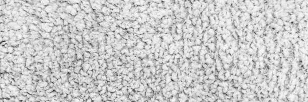 istock A detailed close-up of soft white textured fabric with a fluffy, looped pattern, ideal for stock use in textile, comfort, and interior design themes 2196793165
