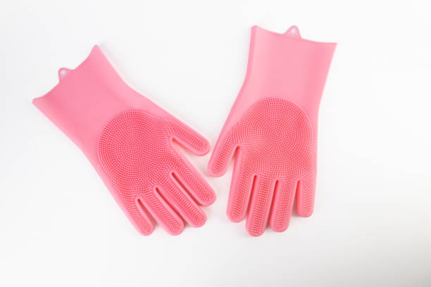 istock On white background lie large thick rubber pink gloves with texture for easy dish washing replacement sponge for dishes care of hands protection from chemicals 2196794007