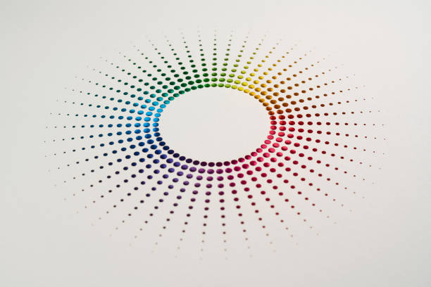 Still life photograph of a sunburst-inspired cut paper design, featuring radial perforations in a vibrant rainbow gradient. The clean white background enhances the artwork’s precision, symmetry, and colorful radiance, creating a striking visual composition.\nNative image size: 7952 x 5304.