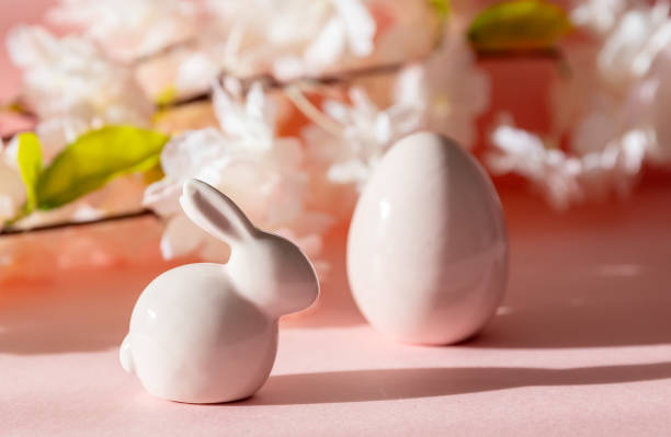 istock Porcelain Easter eggs and bunny on a pink background. 2196795524