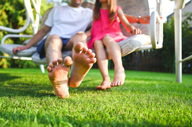 Barefoot family close up.