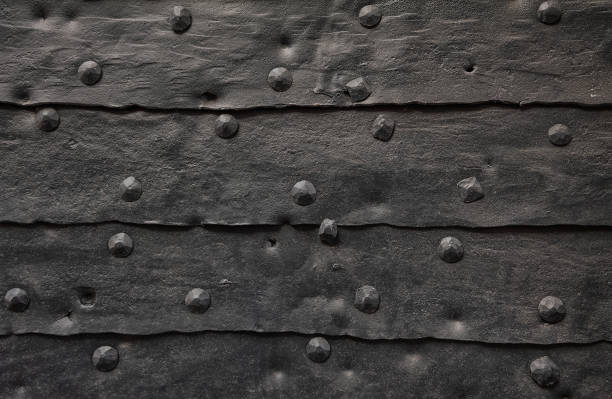 istock Aged metal sheets with rivets creates a textured industrial background 2196800135