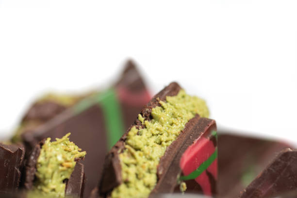 istock Decadent Chocolate with Pistachio Kunafa Filling on White Background 2196800363
