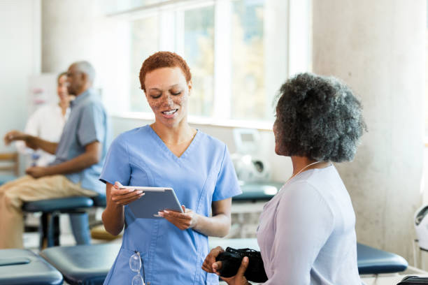 istock Doctor and Patient Discussing Treatment Plan on Tablet 2196801114