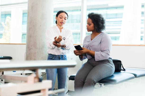 istock Physical Therapist and Patient Discussing Treatment Options 2196801115