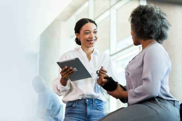 istock African American Therapist Using Tablet, Counseling Patient 2196801119