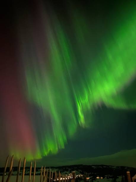 istock Northern Lights over a snow-covered landscape in Norway 2196803379
