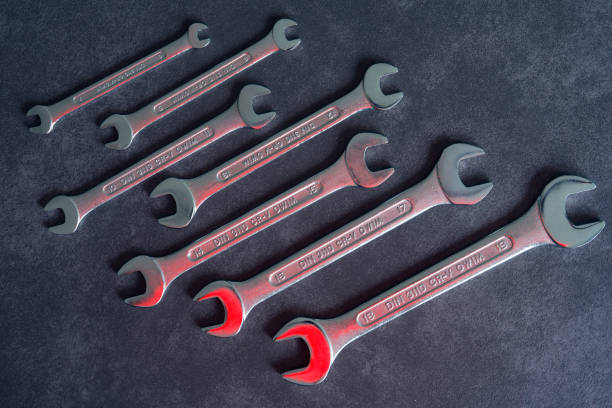 Connected open end wrenches isolated on white vertical hi-res photo