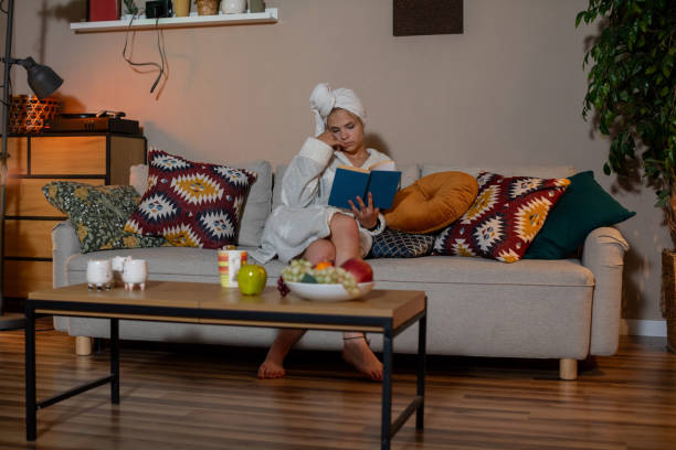 istock Enjoy cozy indoor relaxation with a book and refreshing drinks for perfect leisure 2196804437