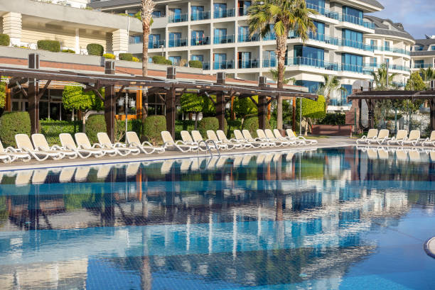 istock Tropical Hotel Resort and Pool with Lounge Chairs 2196804598