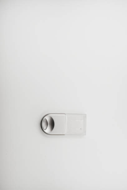 The metal case of the USB adapter. Wi-Fi module on a white background. The Bluetooth adapter's whistle.