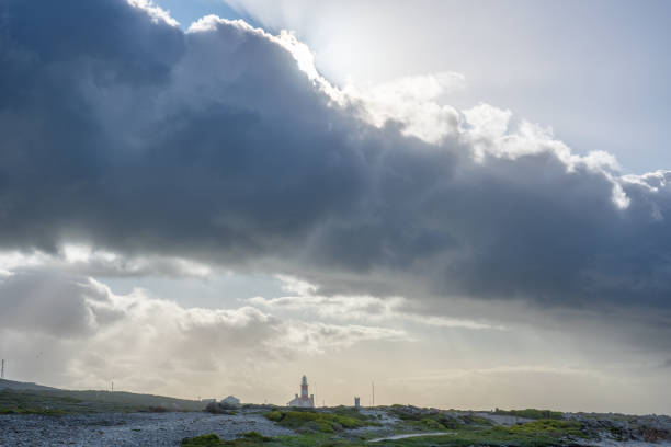 Lighthouse of Cape Agulhas, the geographic southern tip of Africa and the beginning of the traditional dividing line between the Atlantic and Indian Oceans