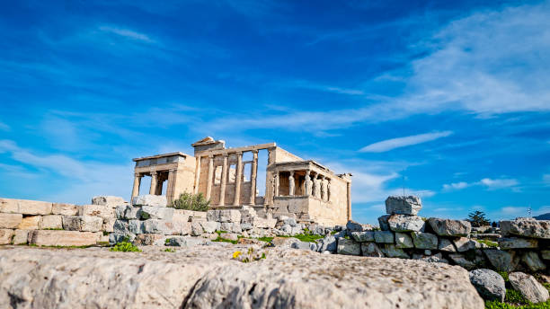 This series captures the Erechtheion, an iconic ancient Greek temple located on the Acropolis of Athens. The unique Ionic columns and the famous Caryatid statues are prominently displayed, showcasing the architectural mastery of classical Greece. The bright blue sky enhances the visual appeal, while the surrounding ruins provide context to the temple's historic significance. As a UNESCO World Heritage Site, the Erechtheion stands as a testament to ancient Greece's cultural and architectural achievements. The setting evokes a sense of timeless beauty and serves as a powerful symbol of Greece's enduring heritage.