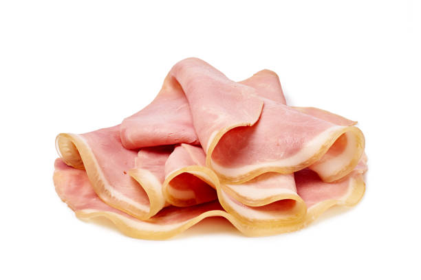 istock Thin slices of pork ham folded and stacked isolated on white background 2196812488
