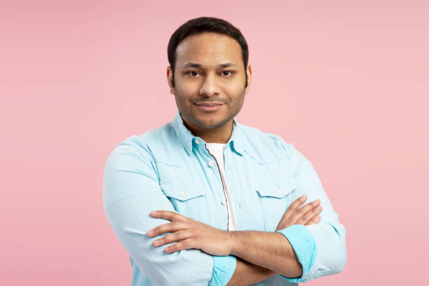 istock Confident indian man crossing arms on pink background 2196815495