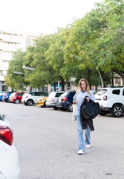 istock Nurse walking in parking lot after work shift 2196817246