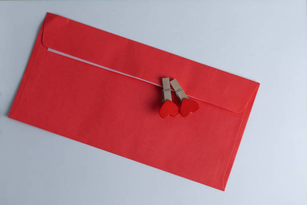 istock red envelope with small clothespins with red hearts on it, love celebration concept 2196818693