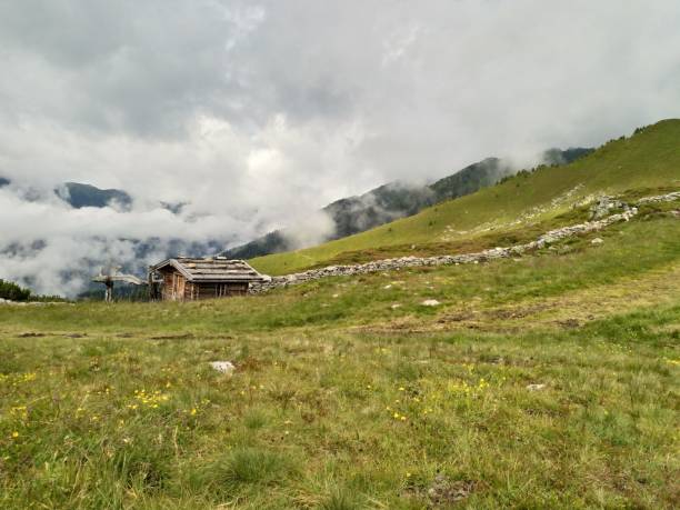 istock House in the fog in Alps 2196819509