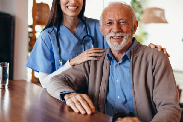 istock Doctor comforting senior man at home visit 2196821594