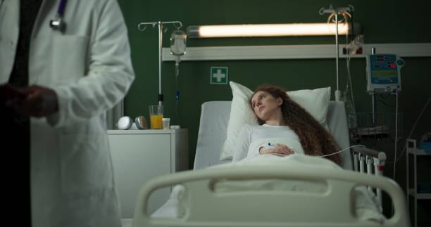 istock Doctor with folder sits next to the patient, sharing important information 2196825993