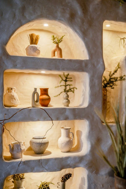 istock decorative wall with backlight and arches in which vases stand. 2196826996