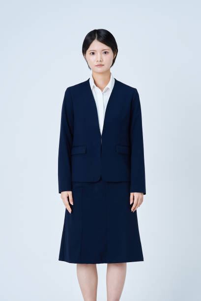 Young woman in a suit and white background